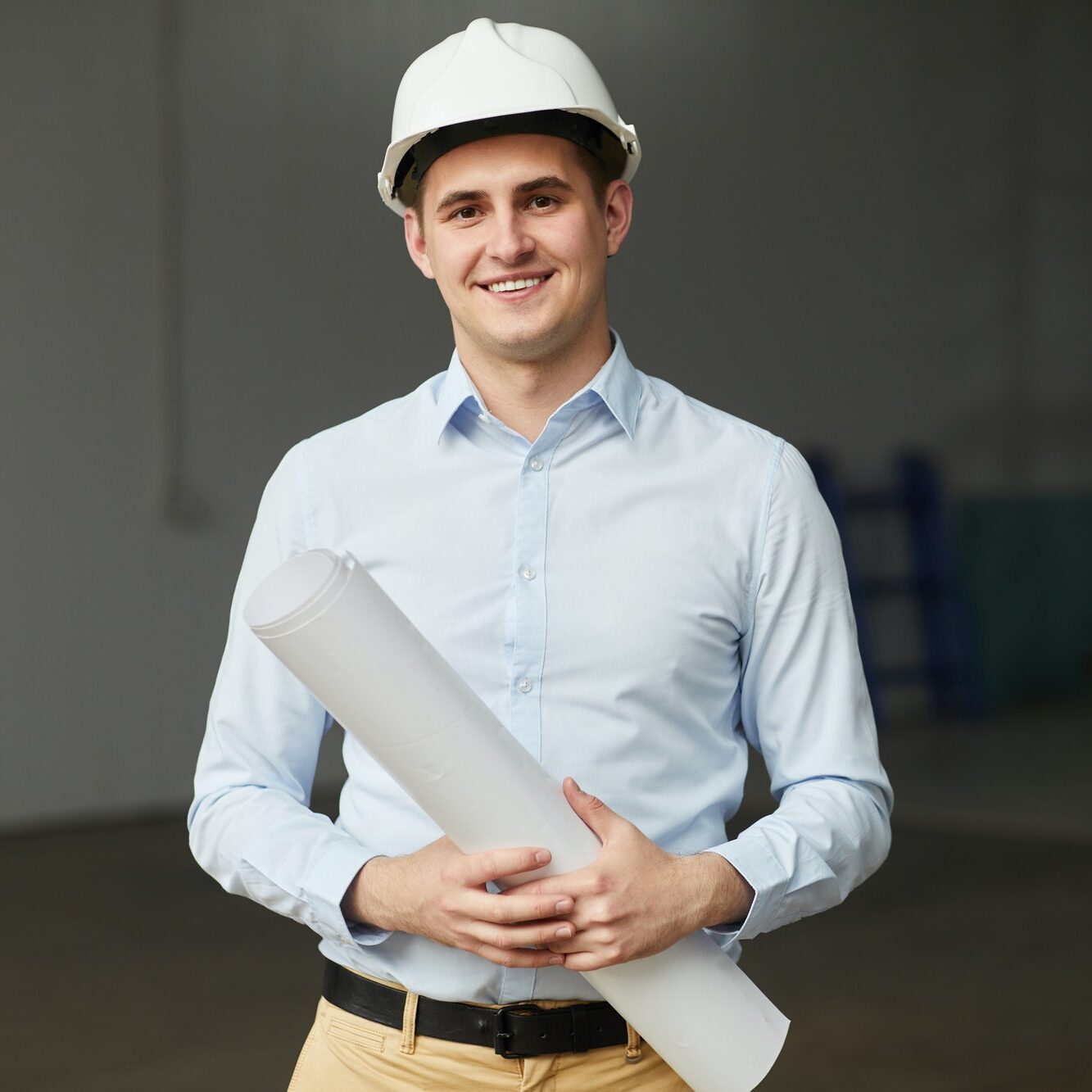 Young architect with blueprint